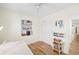 Bright bedroom with wood floors, shelves, and closet at 430 44Th Ne Ave, St Petersburg, FL 33703