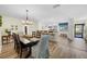 Open concept dining room flowing into the kitchen with bar stool seating and lots of natural light at 430 44Th Ne Ave, St Petersburg, FL 33703