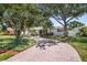 Charming single-story home featuring a brick driveway, lush landscaping, and inviting curb appeal at 430 44Th Ne Ave, St Petersburg, FL 33703