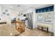 Well-lit kitchen showcasing white cabinets, stainless steel appliances, and a decorative window at 430 44Th Ne Ave, St Petersburg, FL 33703