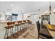 Bright kitchen and dining area featuring bar stool seating, modern lighting, and an open layout at 430 44Th Ne Ave, St Petersburg, FL 33703