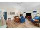 Large living room with vaulted ceiling, hardwood floors, and comfortable seating at 430 44Th Ne Ave, St Petersburg, FL 33703