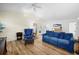 Comfortable living area featuring lots of natural light, cozy seating and new flooring at 430 44Th Ne Ave, St Petersburg, FL 33703