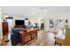 Bright living room featuring vaulted ceiling and wood-look floors at 430 44Th Ne Ave, St Petersburg, FL 33703