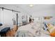 Bright bedroom with ensuite featuring a sliding barn door and vaulted ceilings at 430 44Th Ne Ave, St Petersburg, FL 33703