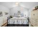 Main bedroom featuring a bed, wood floors, ceiling fan and furnishings at 430 44Th Ne Ave, St Petersburg, FL 33703