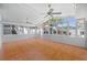 Bright sunroom with tile floor, ceiling fans, and many windows offering lots of natural light at 430 44Th Ne Ave, St Petersburg, FL 33703