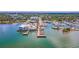 Stunning aerial view of the marina with boats docked along the waterfront and a restaurant on the water at 433 San Salvador Dr, Dunedin, FL 34698