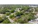 Residential neighborhood with lush greenery and a view of a nearby pond, offering a serene living environment at 433 San Salvador Dr, Dunedin, FL 34698