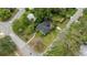 Aerial view of a well-maintained home with a landscaped yard and mature trees at 433 San Salvador Dr, Dunedin, FL 34698