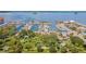 Scenic aerial view of the marina, green spaces, restaurants and waterfront properties along the bay at 433 San Salvador Dr, Dunedin, FL 34698