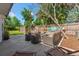 An outdoor living space that offers comfortable seating and fenced backyard views at 433 San Salvador Dr, Dunedin, FL 34698