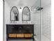 Elegant bathroom with dual sinks, modern fixtures, and a glass-enclosed shower offering a spa-like experience at 433 San Salvador Dr, Dunedin, FL 34698