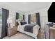 Well-lit bedroom with a bed and a view to the outside with two large windows providing a relaxing space at 433 San Salvador Dr, Dunedin, FL 34698