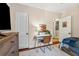 Bedroom with a desk area and views into the hall and another room, with decorative wood floors at 433 San Salvador Dr, Dunedin, FL 34698