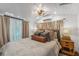 Cozy bedroom with soft lighting, plush bedding, and neutral tones creating a restful retreat at 433 San Salvador Dr, Dunedin, FL 34698