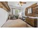 This bedroom features natural wood shelving, rustic wood decor, and a ceiling fan at 433 San Salvador Dr, Dunedin, FL 34698