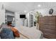 Bright bedroom with wood accents, and a view to the outside creating a fresh and relaxing atmosphere at 433 San Salvador Dr, Dunedin, FL 34698