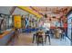 Spacious brewery interior with brewing equipment, high ceilings, decorative walls and rustic barrel tables at 433 San Salvador Dr, Dunedin, FL 34698