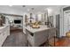 Stylish kitchen island with bar seating, stainless steel appliances, and an open layout design at 433 San Salvador Dr, Dunedin, FL 34698