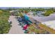 A vibrant street with colorful buildings and parked cars lining the side, showcasing the commercial district at 433 San Salvador Dr, Dunedin, FL 34698
