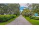 Scenic walking path surrounded by lush greenery, providing a peaceful environment for recreation and relaxation at 433 San Salvador Dr, Dunedin, FL 34698