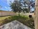 Well maintained backyard featuring a tree, fence, and space for activities at 4633 White Bay Cir, Wesley Chapel, FL 33545