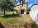 Spacious backyard with a patio, privacy fence, and room for outdoor activities at 4633 White Bay Cir, Wesley Chapel, FL 33545