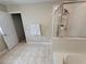 Bathroom with a glass-enclosed shower, a garden tub, and a doorway to another room at 4633 White Bay Cir, Wesley Chapel, FL 33545
