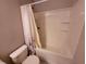 Full bathtub and shower combination with white shower curtain and toilet at 4633 White Bay Cir, Wesley Chapel, FL 33545