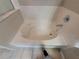 Clean white bathtub with chrome fixtures and a tile surround at 4633 White Bay Cir, Wesley Chapel, FL 33545
