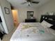 Bedroom featuring neutral walls, ceiling fan, dresser, and a bed with decorative bedding at 4633 White Bay Cir, Wesley Chapel, FL 33545