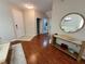 Bright foyer showcasing hardwood floors, a console table, and a welcoming entrance at 4633 White Bay Cir, Wesley Chapel, FL 33545