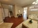 Open foyer with hardwood floors, staircase, and a view into the living room at 4633 White Bay Cir, Wesley Chapel, FL 33545