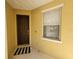 Welcoming front door entrance, complimented with a window and a charming entrance mat at 4633 White Bay Cir, Wesley Chapel, FL 33545