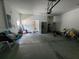Wide garage featuring a refrigerator, storage, and access to the home's interior at 4633 White Bay Cir, Wesley Chapel, FL 33545