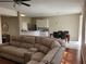 Inviting living space connecting to a dining area, with a sectional sofa at 4633 White Bay Cir, Wesley Chapel, FL 33545