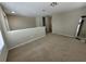 Bright and spacious loft area with neutral carpet and adjacent doorway at 4633 White Bay Cir, Wesley Chapel, FL 33545