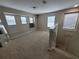 Spacious loft area with neutral carpet, natural light, and stairway access at 4633 White Bay Cir, Wesley Chapel, FL 33545