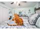 Cozy bedroom featuring a bed, ceiling fan, and soft, colorful decor at 4707 Alma St, New Port Richey, FL 34652