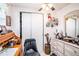 Bedroom with a desk, ceiling fan, and lots of decorations at 4707 Alma St, New Port Richey, FL 34652