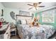 Cozy bedroom featuring a bed, ceiling fan, and soft, colorful decor at 4707 Alma St, New Port Richey, FL 34652