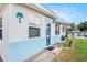 Close-up of the home's inviting entrance, showcasing unique exterior details and a well-kept walkway at 4707 Alma St, New Port Richey, FL 34652