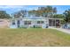 Charming single-story home with a well-maintained lawn, screened porch, and cheerful dolphin accents at 4707 Alma St, New Port Richey, FL 34652
