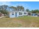 Delightful single-story home with blue trim, decorative yard art, and a cozy, welcoming appeal at 4707 Alma St, New Port Richey, FL 34652