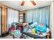 Cluttered living room with lots of storage at 4707 Alma St, New Port Richey, FL 34652