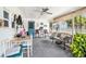 Inviting outdoor porch featuring dining area and lounge seating, perfect for relaxation and entertaining at 4707 Alma St, New Port Richey, FL 34652