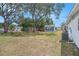 Charming backyard shed, offering practical storage and enhancing the landscape with its inviting design at 4707 Alma St, New Port Richey, FL 34652