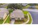 Beautiful home with landscaped yard, a screened garage, and a manicured lawn at 4997 Bostonian Loop, New Port Richey, FL 34655