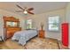 Bright bedroom with ceiling fan and large windows, allowing for ample natural light at 4997 Bostonian Loop, New Port Richey, FL 34655